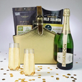 Luxury gold gift basket with Chandon Brut sparkling wine, Pacific Northwest smoked salmon, popcorn, and gourmet snacks — elegant gift option.